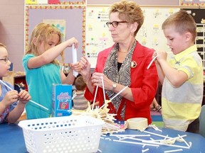 Ontario Premier and Liberal Party Leader Kathleen Wynne paid a visit to Timmins Centennial Public School on Friday morning during her visit to the City to promote healthy food programs. Here, she helps some of the young students sort out straws.
