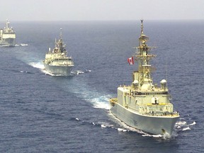 Flagship HMCS Algonquin, HMCS St. John's and HMCS Protecteur. (QMI Agency files)