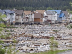 Several homes and lots on the east side of Cougar Creek in Canmore were severely damaged and backyards were swept away by flood waters on Thursday, June 20, 2013.  Justin Parsons/ Canmore Leader/ QMI Agency