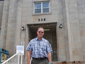 Community mental health advocate Brett Batten stands outside the former site of Regional Mental Health Care - St. Thomas on Saturday. The hospital closed for good after an open house that day. Ben Forrest/QMI Agency/Times-Journal.