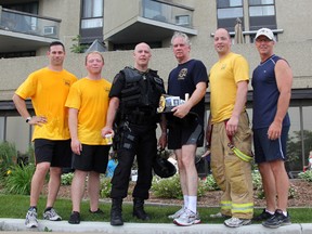 Local first responders participated in the 2nd annual Run up for Rebound event at the Seaway Centre in Sarnia, Saturday. Pictured are Sarnia firefighters Jeff Cowen and Chris Downham, Sarnia Police Const. Les Jones, firefighters Kevin McHarg and Peter Varro, and Sarnia Police Const. Chris Moxley. TARA JEFFREY/THE OBSERVER/QMI AGENCY