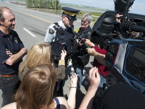 TAYLOR WEAVER HIGH RIVER TIME/QMI AGENCY Staff Sergeant Brian Jones with the RCMP, with High River Mayor, Emile Blokland, informed media of the recent developments in the High River flooding, Sunday, June 23, at 11:30a.m.