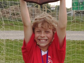 Contributed Photo
Pickard Home Building Centre atom player Jack DeSerrano holds up the championship plaque after his team won the Atom Boys U11 tournament on June 9.