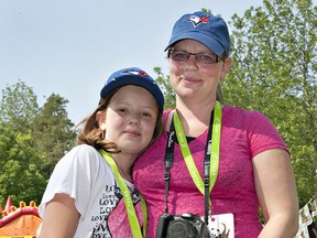 Nine-year-old Rayna Crawford of Paris, a youth ambassador for the Juvenile Diabetes Research Foundation, takes part with her mother, Kim Mantua, in the annual Walk to Cure Diabetes on Sunday at Waterworks Park. (Brian Thompson, The Expositor)