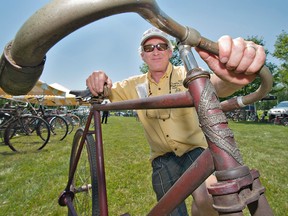 Jamie McGregor, organizer of the annual Vintage Bicycle Show on Sunday at Heritage View Farm on Tutela Heights Road, shows a 1904 Brantford Red Bird 57 Special shaft-drive bicycle. The shaft-drive design had women in mind, so their long dresses would not get caught or soiled in a chain. They were made for only a few years, mainly because the bicycle had no brakes. (Brian Thompson, The Expositor)