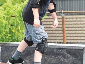 Court Emm-Jones, 10, practises his skills on a ramp prior to a skateboard contest Saturday. (DONAL O'CONNOR The Beacon Herald)