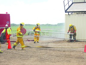 Crews demonstrate fire fighting techniques during the opening of the Bonnyville Regional Fire Authority’s new training centre June 22.