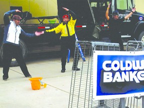 Sgt. Frank Szabon of the 4 Wing military police (in yellow jacket) and other participants dance to “YMCA” during the Free the Fuzz event, held to raise money for Special Olympics.