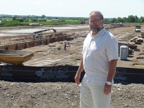 David Johnston, the county's general manager of economic development and strategic investments, surveys the construction being done on the new Adidas Canada Ltd. site at the Brant 403 Business Park. (MICHAEL-ALLAN MARION Brantford Expositor)