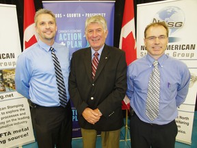 MP Dave MacKenzie, centre, with North American Stamping Group general manager Fred Gehring, left, and sales manager Ken Schlimme at the announcement of a $10.9 million operations expansion. HEATHER RIVERS/WOODSTOCK SENTINEL-REVIEW