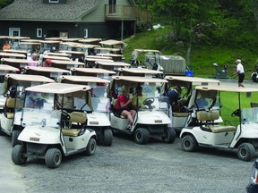 About 80 golfers prepare to head out on the links on a drizzly June 13 to raise money for the Thousand Islands Playhouse.   Contributed photo