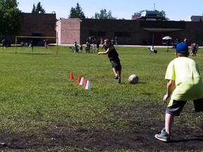 Students take shots on the net during Sports Day at La Verendrye School, Monday. (ROBIN DUDGEON/PORTAGE DAILY GRAPHIC/QMI AGENCY)