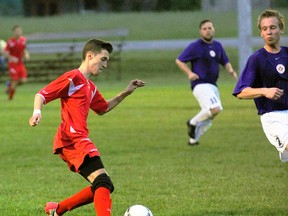 SARAH DOKTOR Delhi News-Record
George Makrynoris, left, of the Norfolk Royals takes possession of the ball during a recent game against the White Eagles Soccer Club. The Royals will face Woodstock this Friday in Delhi.