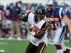Ticats returner Lindsey Lamar carries the ball during a recent pre-season game against the Montreal Alouettes. In two games, he has returned nine punts for 243 yards and two touchdowns. (Ben Pelosse/QMI agency)