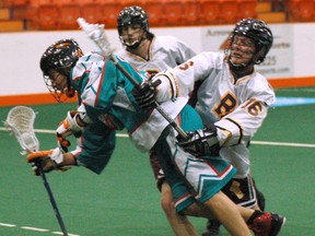 Six Nations Pro-Fit Chiefs' Alex Kedoh Hill has a tough time getting past  a Brampton Excelsiors defender during a Major Series Lacrosse game. (Darryl G. Smart, The Expositor)