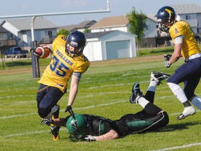 Above, the Grande Prairie Drillers’ Owen Zawyrucha dodges a Lloydminster Vandals’ tackle in Alberta Football League play at St. Joseph High school Saturday.