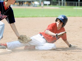 Chatham's Sam Haight, right, beats the tag by Bolton Braves third baseman Ethan Seymour during the Diamonds' 10-0 semifinal win in the Chatham Minor Baseball Association minor peewee tournament Sunday at Kinsmen Park. (MARK MALONE/The Daily News)
