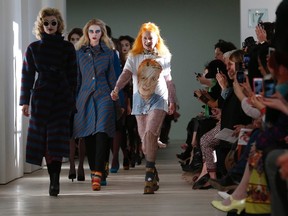 Vivienne Westwood joins her models on the catwalk after the Vivienne Westwood Red Label Autumn/Winter 2013 collection presentation during London Fashion Week, February 17, 2013. (REUTERS/Suzanne Plunkett)