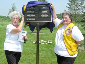 The Tiverton Lions’ Club and Municipality of Kincardine presented the “Walk of Memories” dedication ceremony on Sunday June 23, 2013. The Lions’ Club has memorialized loved ones by planting to date 186 trees, of which 21 were honoured. The individuals remembered throughout the park is 217, with signs, floral displays, a gazebo, and a waterfall. The Walk of Memories was started in 1999 and is maintained by the Tiverton Blooms. Edna McTeer and Rubena MacLennan of the Tiverton Lions’ Club present the plaque commemorating the 21 trees planted in memory of loved ones. (JULIA HERRICK/KINCARDINE NEWS FREELANCE)