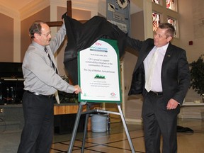 (L to R) Melfort Mayor Rick Lang and Brad Butterwick of CN unveil the sign for the new planting poject on Shadd Drive on Thursday, June 20 at the Evangelical Covenant Church.