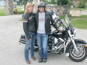 The Tiverton Lions Club held its first ever Motorcycle Poker Rally with proceeds going to support the CNIB on Saturday, June 22, 2013. Teroi Pullman (L.) and Dave Sullivan, from Port Elgin, get ready to head out on the route to gather what they hope will be a winning hand. While the Lions originally hoped to raise $1,000 with the new event, response was tremendous and over $2,000 was raised. (JOHN F. ADAMS/KINCARDINE NEWS FREELANCE)