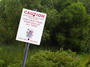 A sign in Rosethorn Park warns people away from a stormwater pond. St. Thomas police say the wooded area has become a haven for drug users, and they are keeping their eye on it. (Eric Bunnell/QMI Agency/Times-Journal)