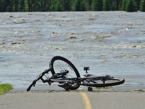 A bike path is washed out in Fish Creek, after the city was swamped by heavy rains. (QMI Agency file photo)