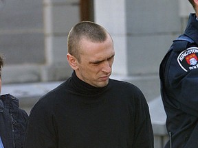Michael Beauchamp is led away by police during his manslaughter trial in Kingston in 2002.
The Whig-Standard