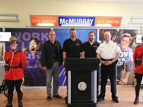 Flanked by two of the Wood Buffalo RCMP’s finest, Rick Kirschner, Sheldon Germain, Adam Hardiman and Rob McCloy were on hand Tuesday to announce the new City Centre McMurray Half Marathon set for Sept. 15. AMANDA RICHARDSON/TODAY STAFF