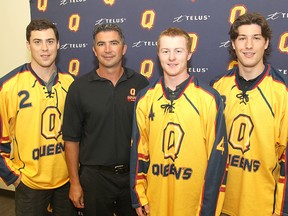 Queen’s University hockey coach Brett Gibson, second from left, introduces new recruits, from left, Chris Van Laren from Kingston, Kris Grant from Odessa and Kevin Bailie from Belleville, during a news conference Tuesday.