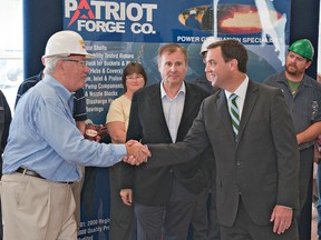 John Dimitrieff (left), chairman and co-founder of Patriot Forge, thanks Ontario PC Leader Tim Hudak for visiting the Henry Street plant Tuesday. In his remarks, Hudak noted that Patriot Forge's electricity costs in Brantford are 30% higher than their plant in Canton, Ohio. (Brian Thompson, The Expositor)