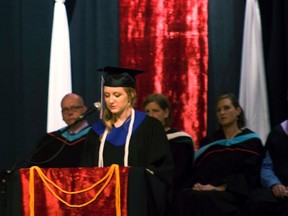 Valedictorian Raela Pryor speaks to the Class of 2013 as staff look on during the Westpark School graduation, Tueday. (ROBIN DUDGEON/PORTAGE DAILY GRAPHIC/QMI AGENCY)