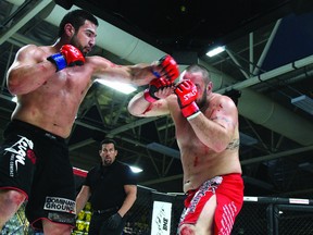 Mike Hackert fights Tim Hague during the main event of Prestige FC IV last year. RMWB council approved a  bylaw Tuesday that will create a local commission to regulate combat sports like mixed martial arts.  TODAY FILE PHOTO