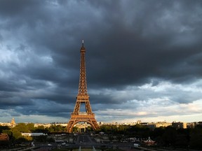 The Eiffel Tower is seen under clouds in Paris May 28, 2013. (REUTERS/Benoit Tessier)