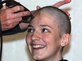 Students shave their head for cancer