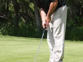 The Mighty Peace Golf Course, outside of Peace River, held the Alberta Golf Association's northern qualifier for the 2013 Sun Life Financial Men's Amateur Championship on Monday, June 17, 2013.  Pictured: Alan Stewart of Grande Prairie Golf and Country Club eyes his putt. The top four qualifiers will attend the amateur championships in Sunrde, Alberta on July 16-19.
MICHAELA HIEBERT/PEACE RIVER RECORD-GAZETTE