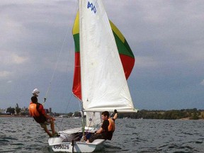 Seen here is Riley Nadeau ‘trapezing’ (standing and leaning) a technique used to keep the sailboat balanced as it planes through the water. Photo supplied.