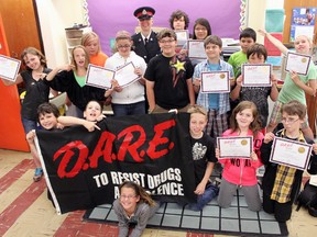 Sacred Heart Catholic School students gathered with Constable Melissa Rancourt after their DARE graduation.
Photo by Dawn Lalonde/Mid-North Monitor/QMI Agency