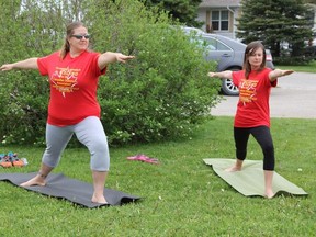 Christina Doucette and April Porter will be running a half marathon in Reykjavik, Iceland in August 2014 for the Canadian Diabetes Association. Here they are at their kick off fundraiser doing yoga.