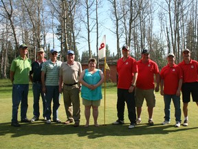 Contestants in the championship round of the Hines Creek Skins Golf tournament: on the left, winners, Adventure Automotive: Jack Mehlsen, Dan Frayne, Ken French, Keith Steinke and Mary Pelz, on the right second place Febu Outdoors - Tim Berg, Brian Bak, Ed Murphy and Fenton Burns.