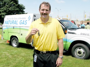 Union Gas president Steve Baker holds the key to the first of five new compressed natural gas and gas powered service utility vehicles purchased by the energy company for use in Chatham-Kent, Ontario on Wednesday June 26, 2013.
The dual fuel trucks will mean 30% savings on fuel costs and a 30% reduction on tailpipe emissions.
(VICKI GOUGH/ THE CHATHAM DAILY NEWS/ QMI AGENCY)