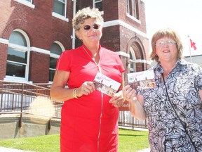 Huron East economic development officer Jan Hawley and Maureen Agar display the Go Postal postcards promoting Canada Day events in Seaforth on July 1.