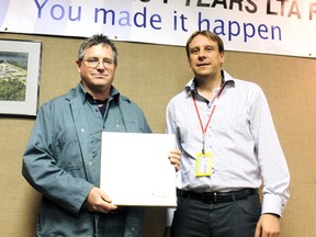 Chris Astles, general manager of Cameco’s Blind River refinery, was presented with a plaque commemorating 30 years of service from Dale Clark, Cameco vice-president, on June 20.
Photo by JORDAN ALLARD/THE STANDARD/QMI AGENCY