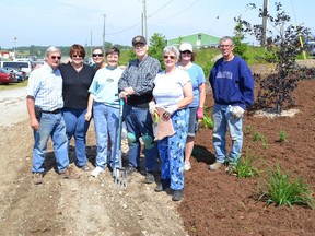 SUBMITTED PHOTO
The Paris Horticultural Society and Paris Agricultural Society teamed up this past weekend to plant about 100 shrubs and perennials at the Paris Fairgrounds Saturday, June 15, 2013. Pictured, from left: Dave Collins, Linda Head, Serryn Stephenson, Pat Hasler-Watts, Bob, Hasler, Hilary Whittaker, Carol Reansbury and Doug Hanna.