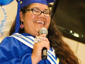 Yellowquill College mature Grade 12 student validictorian Anita Longclaws gives a rousing speech to her graduating class at Keeshkeemaquah Conference and Gaming Centre on Tuesday. This year's graduating class was the largest at 26 students, the largest Long Plain First Nation has ever had in its history. (Svjetlana Mlinarevic/Portage Daily Graphic/QMI Agency)