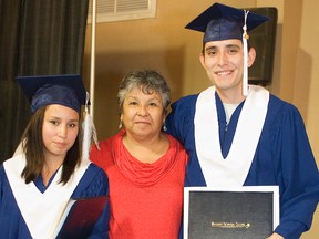 Portage Learning and Literacy Centre's students Crystale Assiniboine and Adam Page stand next to Liz Merrick, director of education at Long Plain First Nation on Tuesday during the school's graduation ceremony at Canad Inns. Assiniboine won the PLLC Board of Directors Award for Most Deserving Student. (Svjetlana Mlinarevic/Portage Daily Graphic/QMI Agency).