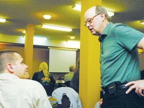 Hugh Sanders, the current BRWA board chair, talking with the past chairmen of the organization, Jeremy Enarson at the annual 2013 meeting.