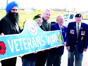 Pictured helping to declare Highway 21 through the Fort as Veterans Way, Edmonton-Sherwood Park MP Tim Uppal (left), whose constituency extends through Fort Saskatchewan, voted against a motion to change criteria for The Last Post Fund. The fund ensures proper burial and funeral arrangements for veterans. Uppal stated there is already significant funding for the initiative.

File Photo