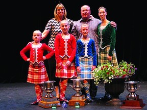 From left: Lauren Abrahart, Ashley Abrahart, Callie Boan and Kirsten Gardner stand with their coaches, Kelly Abrahart and Bill Troock, at the provincial Highland Dance Competition in May.