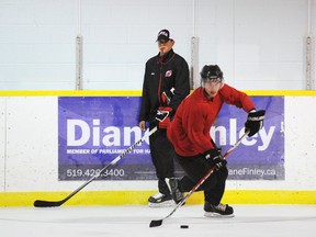 File Photo
In this photo from 2011, Simcoe native and AHL coach Rick Kowalsky watches as local junior player Braeden Shand carries the puck during the Kowalsky Elite Ice Conditioning Camp. The six-week camp is designed to help players ready for tryouts.